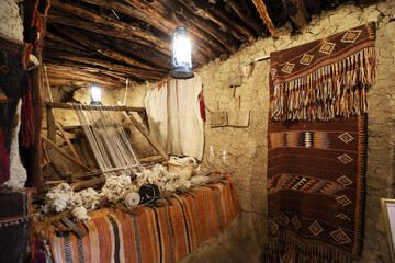 old traditional crafts in old arab mud house interior- Al Malad heritage Museum - Al Baha , Saudi...