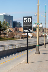 Speed limit road sign in the street, 50 km per hour maximum in Ottawa city, Canada.