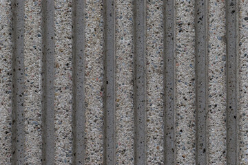 Grey textured striped stone wall background, full frame