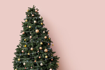 Glowing Christmas tree with presents near pink wall