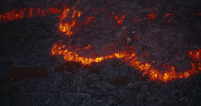 Aerial view of lava flow from the Hawaii Mauna Loa volcano eruption of 2022, Hot lava and magma flowing down the mountain, Shot on RED