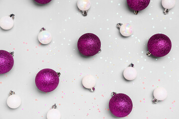 Beautiful Christmas balls with sequins on grey background