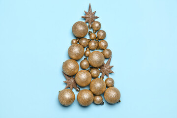 Christmas tree made of golden balls and stars on blue background