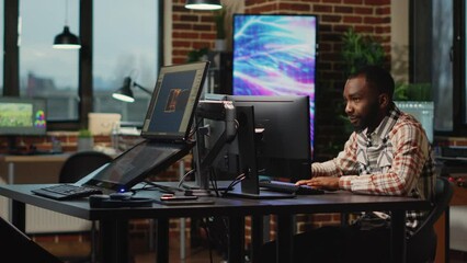 African american web developer working in artistic office to create CGI content on 3d software, digital skills. Creative agency designer using professional interface to develop infographics.
