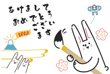 2023年年賀状　あけましておめでとうと毛筆でしたためるうさぎ　はがきテンプレート	
