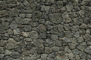 Texture of grey stone wall as background