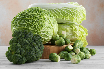 Fototapeta premium Different types of fresh cabbage on white wooden table
