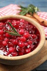 Fresh cranberry sauce with rosemary in bowl, closeup