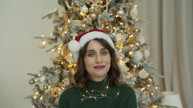woman calls her friends via video conference call wishing Merry Christmas