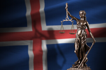 Iceland flag with statue of lady justice and judicial scales in dark room. Concept of judgement and...