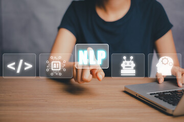 NLP natural language processing cognitive computing technology concept, Business person hand holding VR screen NLP icon with blue bokeh background, AI Artificial intelligence.