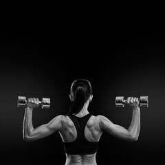 Fototapeta na wymiar Fitness woman in training muscles of the back with dumbbells