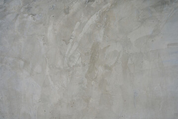 The cement flap surface has scratches, black and white stains, traces caused by plastering to create an artistic pattern