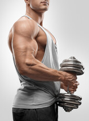 Strong and power bodybuilder doing exercises with dumbbell