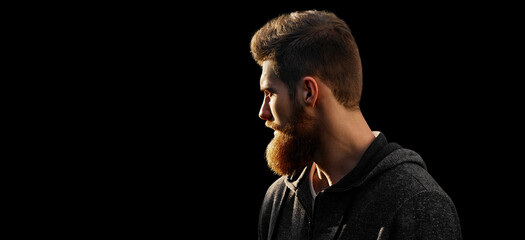 Profile young handsome serious bearded man