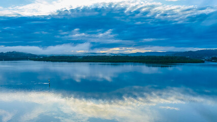 Respite from the rain - Bay waterscape with reflections