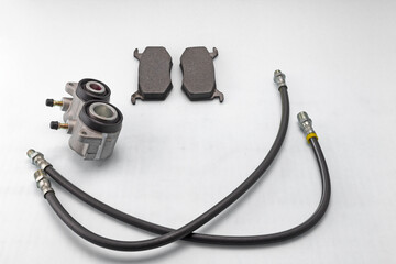 automotive parts and components of the brake system for completing mechanisms and repairing a car on a white milky background.