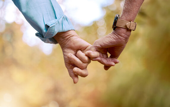 Retirement, senior couple and holding hands for love, romance and bonding together. Romantic, hand gesture and loving for relationship, marriage and support for anniversary, retired and healthcare.