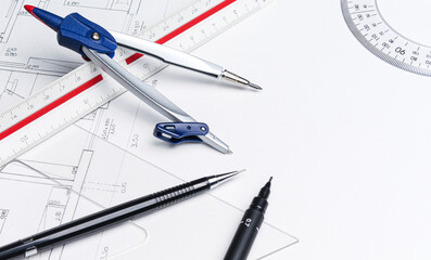 Architectural tools on the drawing board.