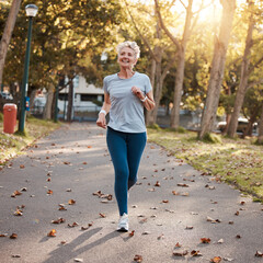Park, running and fitness with a senior woman outdoor for cardio or endurance training in summer....