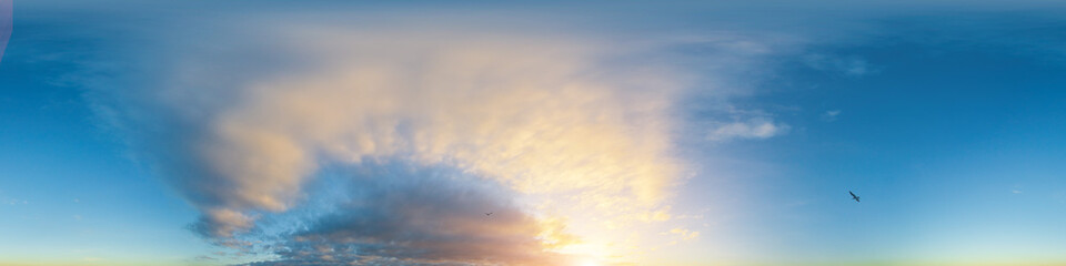 Golden glowing sunset sky panorama with Cirrus clouds. Hdr seamless spherical equirectangular 360 panorama. Sky dome or zenith for 3D visualization and sky replacement for aerial drone 360 panoramas.