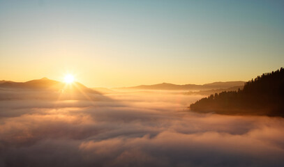 Beautiful sunrise in the sea of fog in the Pieniny Mountains.