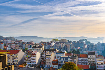 Fototapeta na wymiar Porto, Portugal. View of the city's houses and roofs in the morning light