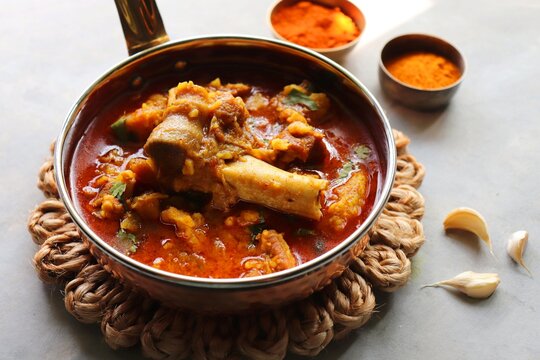 Mutton Rogan josh or mutton masala is India's famous Spicy nonvegetarian dish. It's made out of Goat meat and spices, garnished with fresh coriander. Lamb curry. copy space.