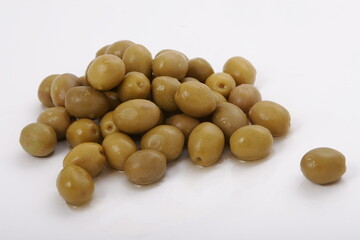Fresh wet olives on a white surface