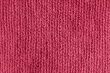 Trendy color of 2023 viva magenta. texture of knitted angora fabric. magenta wool texture. Knitted...