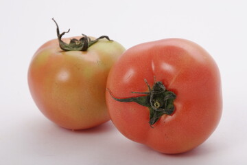 Pair of fresh whole red tomatoes