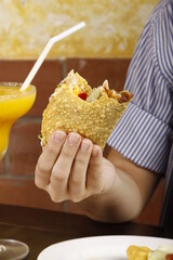 Closeup of a half-eaten taco in a hand