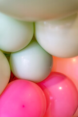 Colourful balloons party background with many colours like green and pink