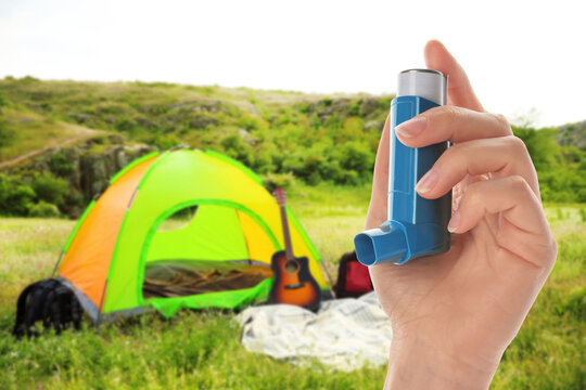 Young Woman Using Asthma Inhaler Outside On Sunny Day, Closeup. Emergency First Aid During Outdoor Recreation