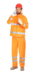 Man in reflective uniform talking on smartphone against white background