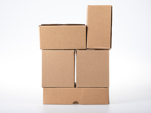 Cardboard boxes pile of brown carton box five on white grey background