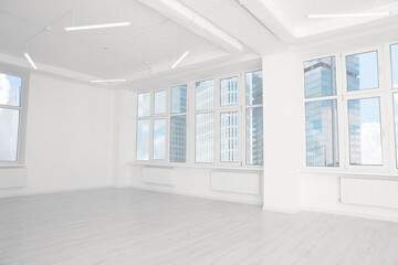 Fototapeta na wymiar Modern office room with white walls and windows. Interior design