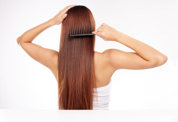 Hair care, brush and back of woman with comb for haircare maintenance, self care grooming or...