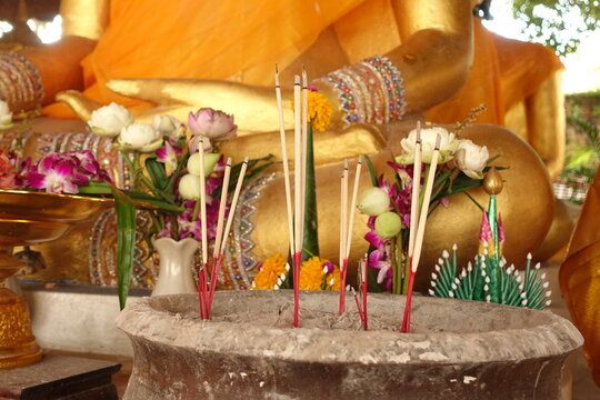 Incense sticks on joss stick pot are burning and oblation use for pay respect to Buddha statue,Ayutthaya province Thailand (Visakha Puja Day,Asalha Puja Day,Magha Puja Day concept)