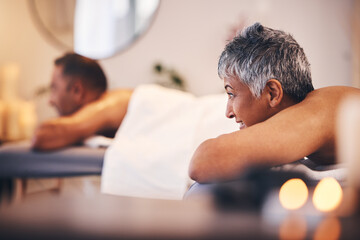 Senior woman, spa and man on massage bed with happiness, peace and relax for health getaway. Couple, wellness and physical therapy in salon, holistic body treatment and blurred background in Jakarta