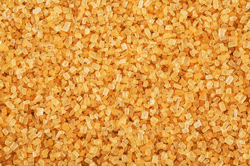 Background texture of brown cane sugar crystals