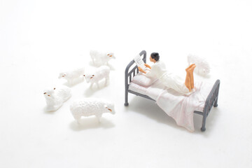 a mini figure, the Sleepless counting sheep
