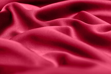 Purple fabric background in color Viva Magenta.Demonstrating the colors of 2023.