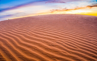 The red sand dunes in sunset at Mui ne, Vietnam is popular travel destination with long coastline. Mui Ne Sand Dunes, Vietnam.