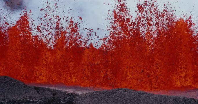 Slow motion of lava fountain shooting up into the air from the Hawaii Mauna Loa volcano eruption of 2022, Hot lava and magma erupting out of the volcano,  Shot on RED