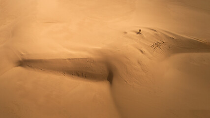 Aerial View of people climbing a desert dune in Death Valley, California, USA