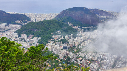 An aerial view of Rio de Janeiro shrouded in fog. Seen from the helipad area of Mirante Dona Marta,...