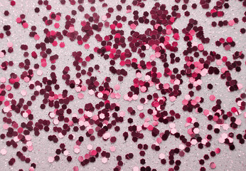 Festive background with glitters in trendy color viva magenta