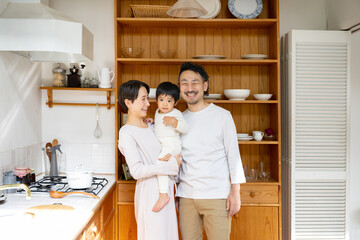 Portrait of a smiling family in the kitchen
