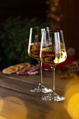 White wine in glasses on a wooden table